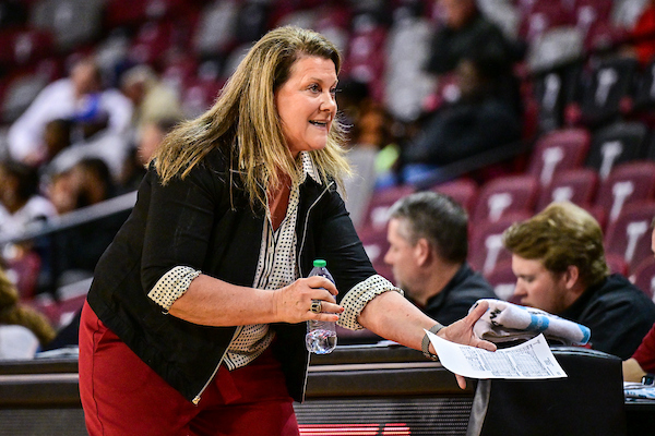 Coach Rigby coaching the women's basketball team