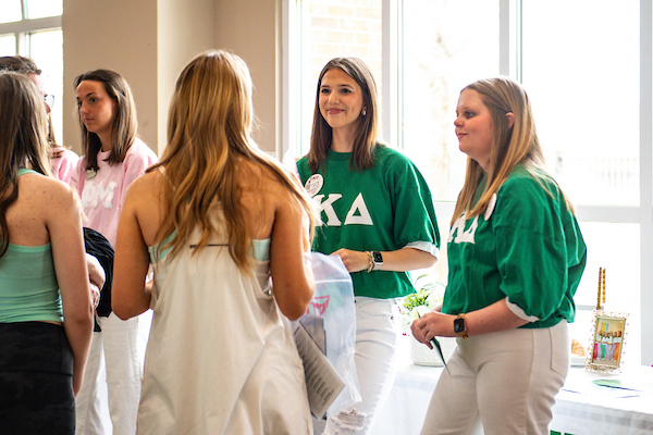 Prospective students talking to a Greek organization at the Trojan Day Browse Session.