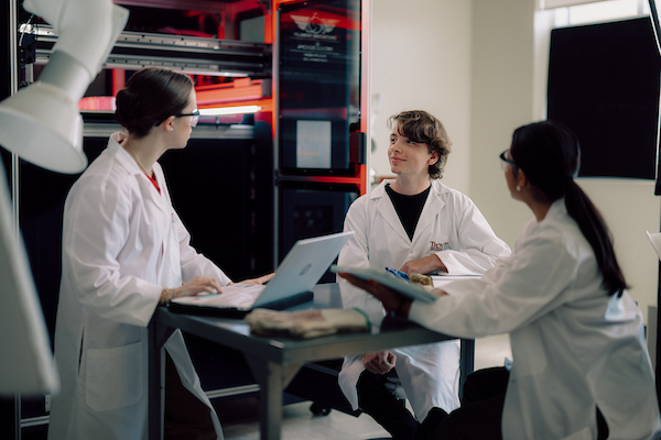 TROY students working in the lab