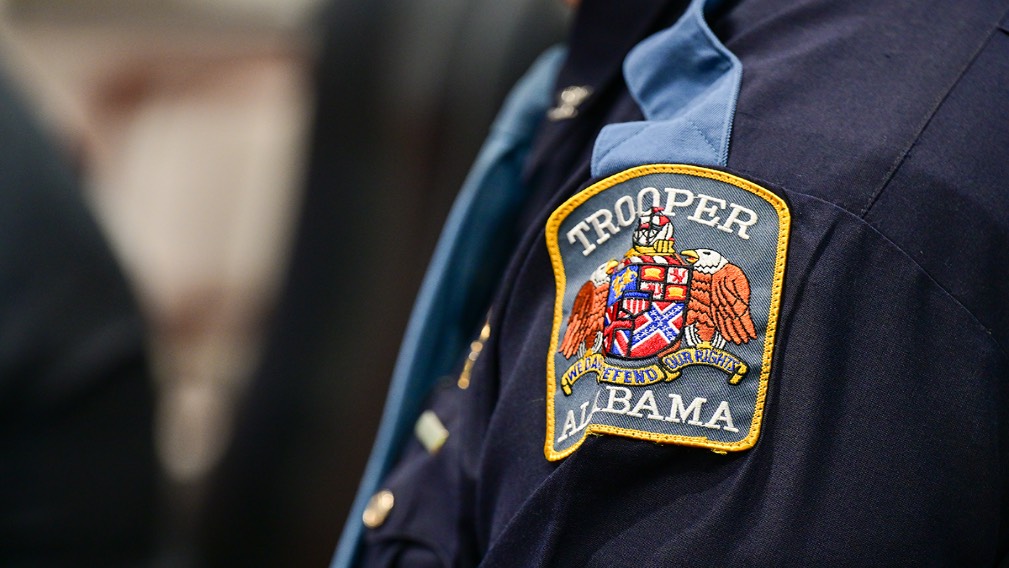 Close up of State Trooper badge on left shoulder