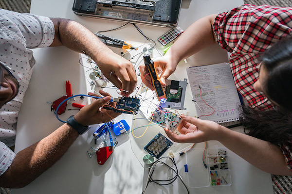 TROY students working on electronics 