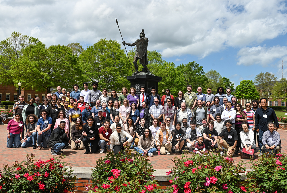 A group photo of the 2025 Math Fest participants in front of the Trojan Statue that stands tall at the center of the main quad at Troy University.