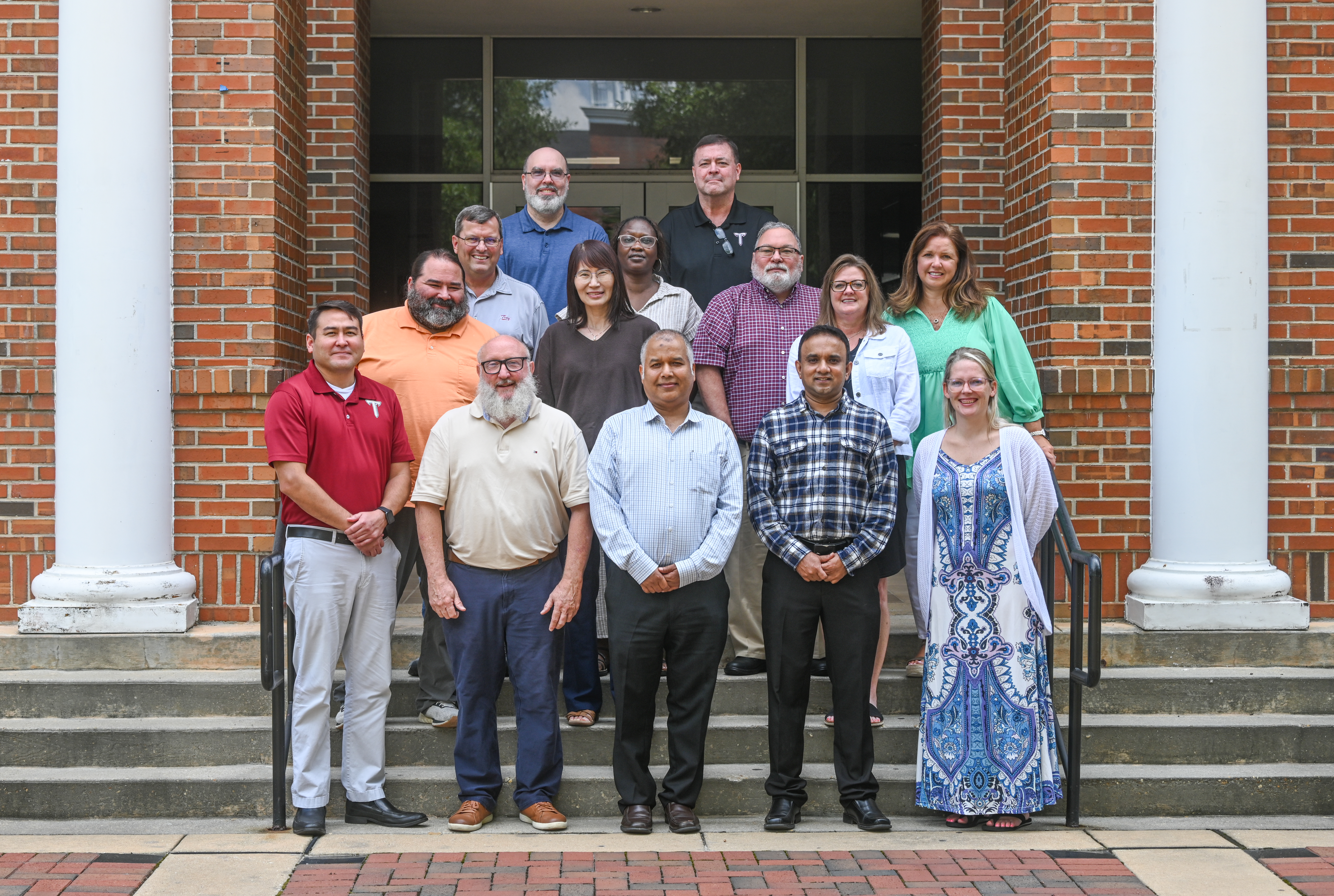 department photo of math and statistics faculty on the steps of McCall Hall