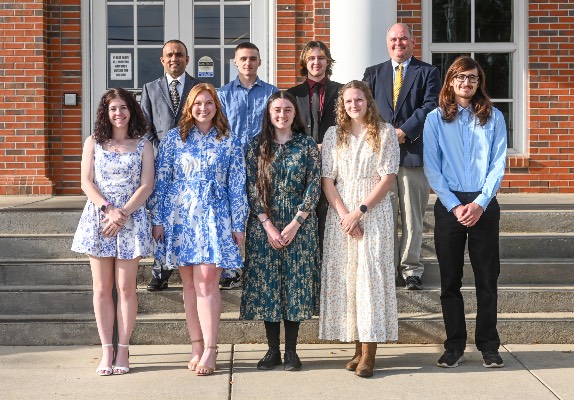 2025-2026 Pi Mu Epsilon students on the steps outside of the Dining Hall