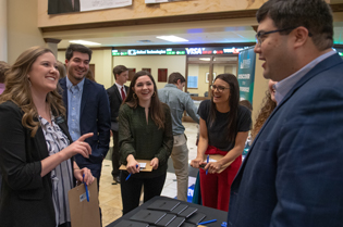 Troy University students talking in John Robert Lewis Hall