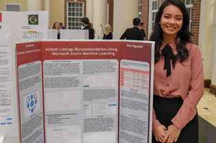 Troy University business student presenting and informational report