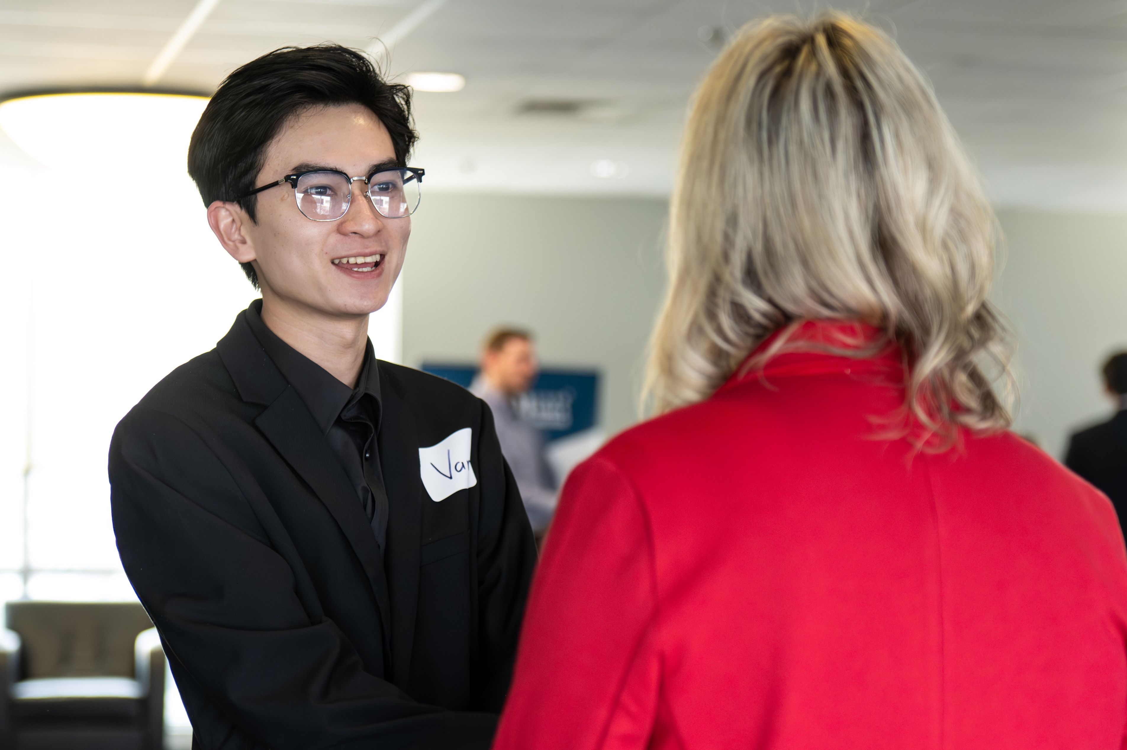 Students meeting with firms at a job fair