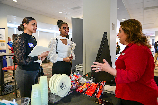 Students Talking with an employer at a Career Day Booth