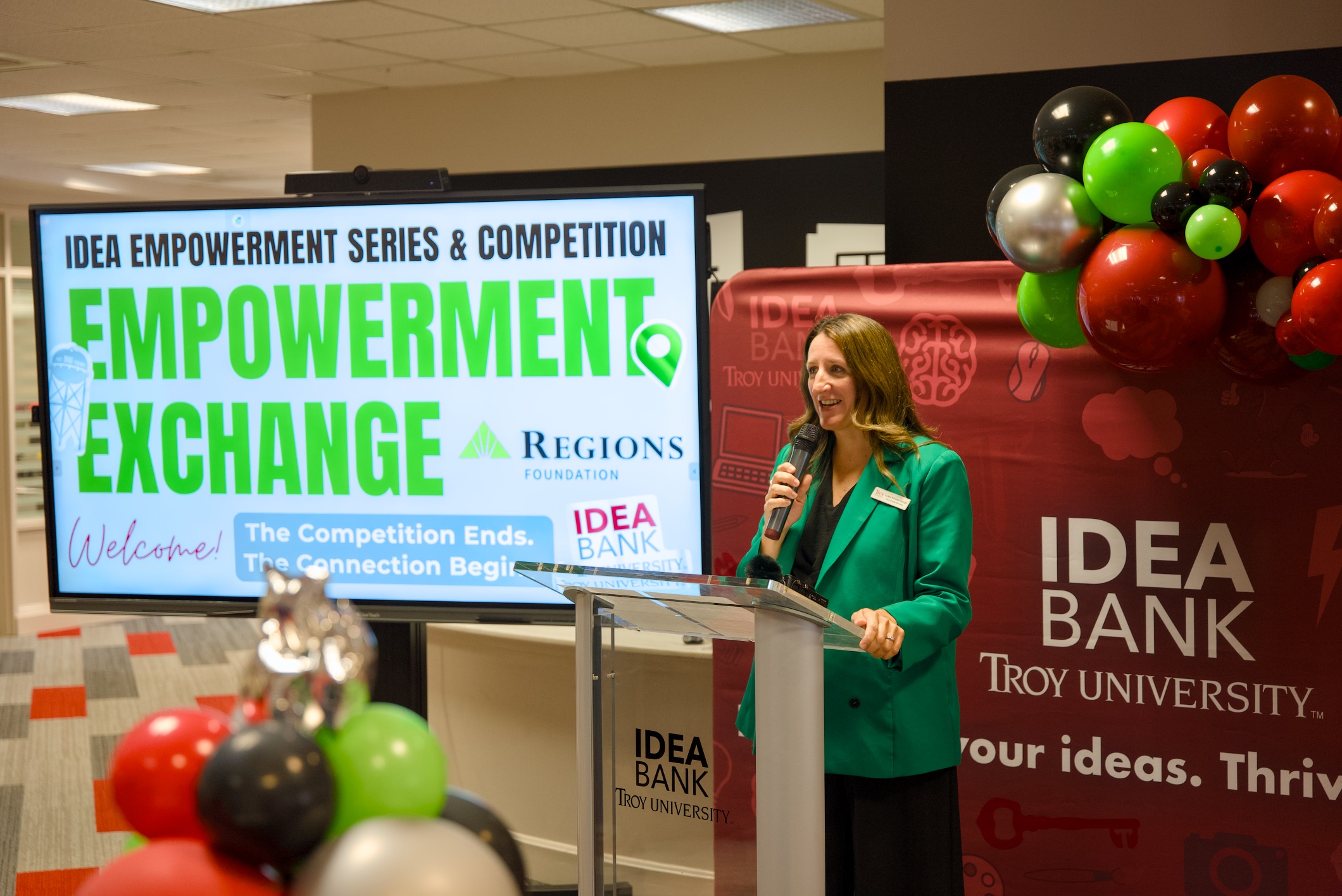 guests listening to a presentation from idea bank director lynne george