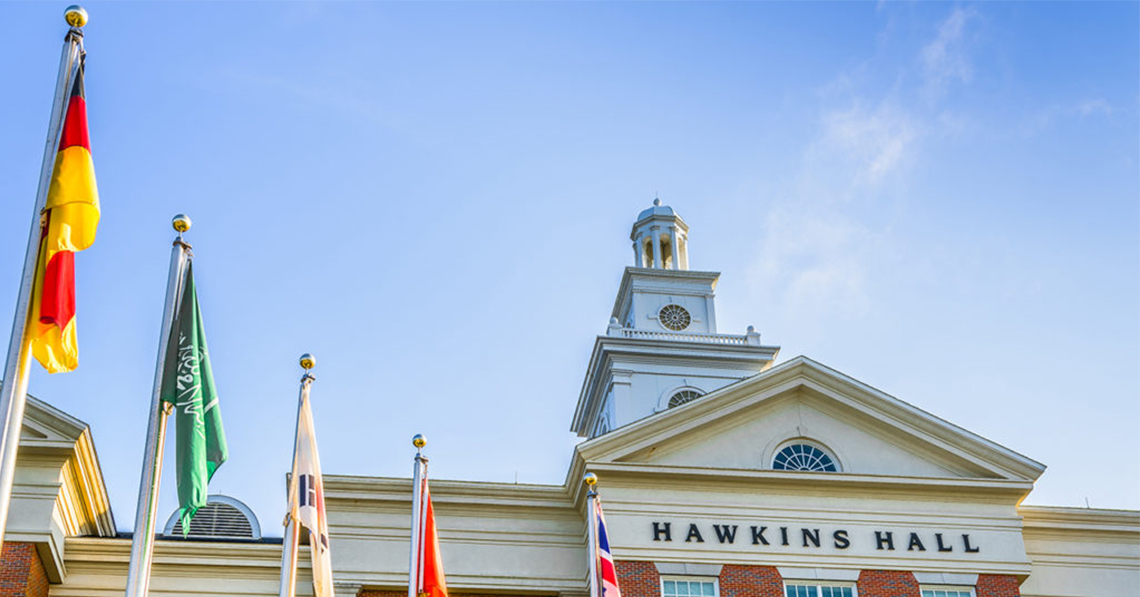 Flags in front of Hawkins Hall building