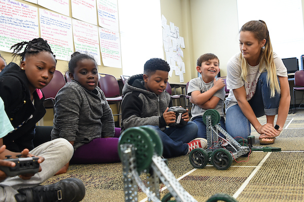 Troy University students working in the classroom with elementary students. 