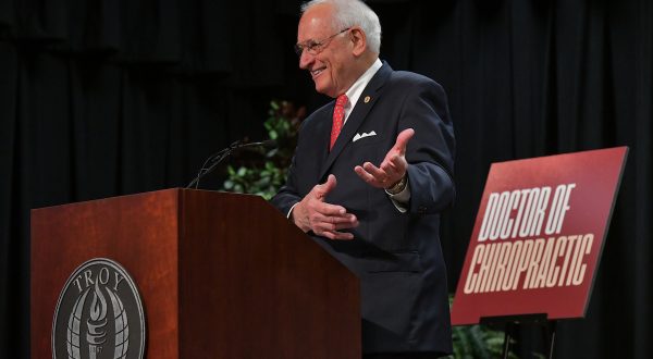 Dr. Hawkins announcing the Doctorate of Chiropractics