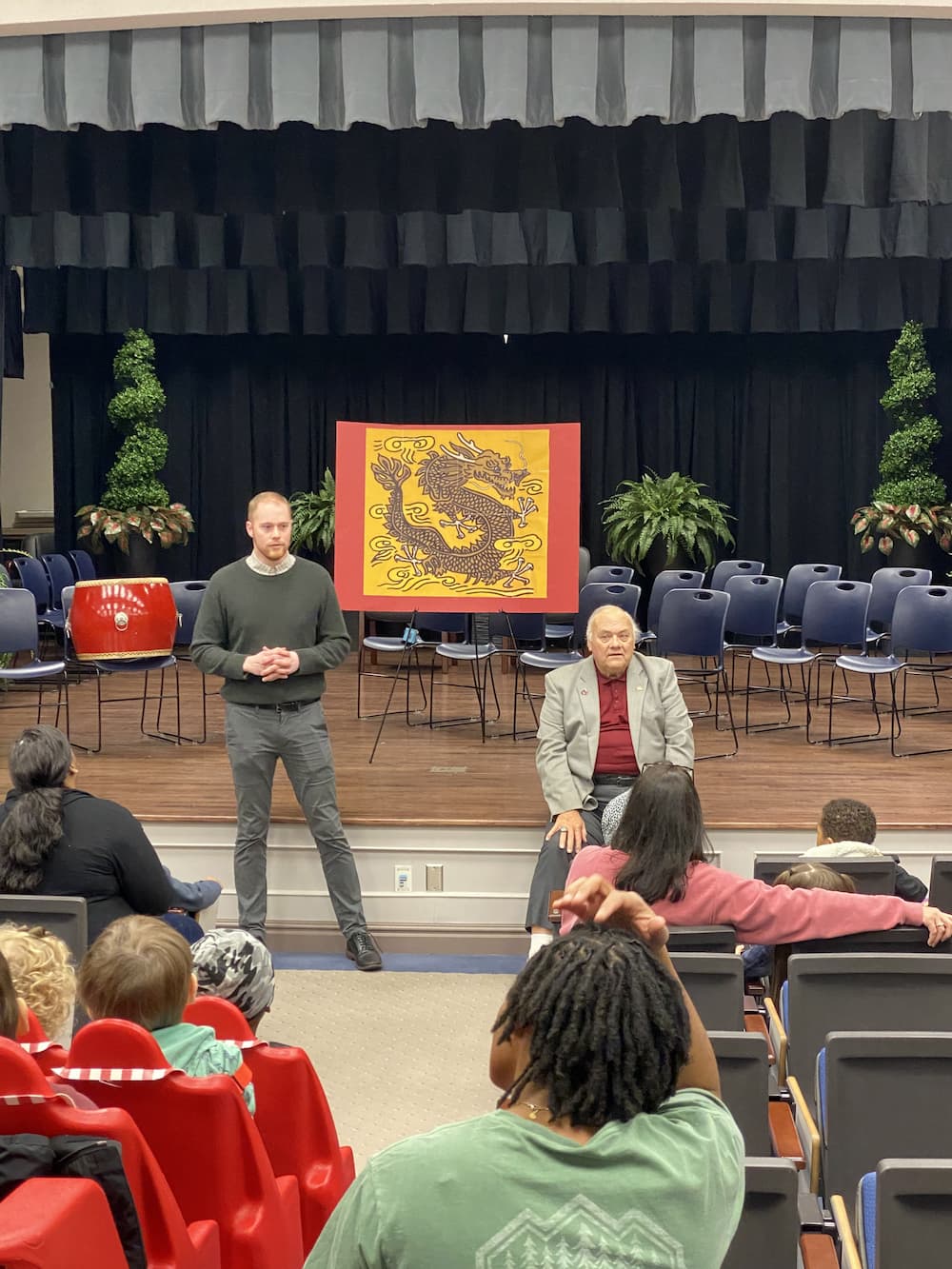 Austin Deal giving a presentation of the cultural history of the dragon to Dothan students