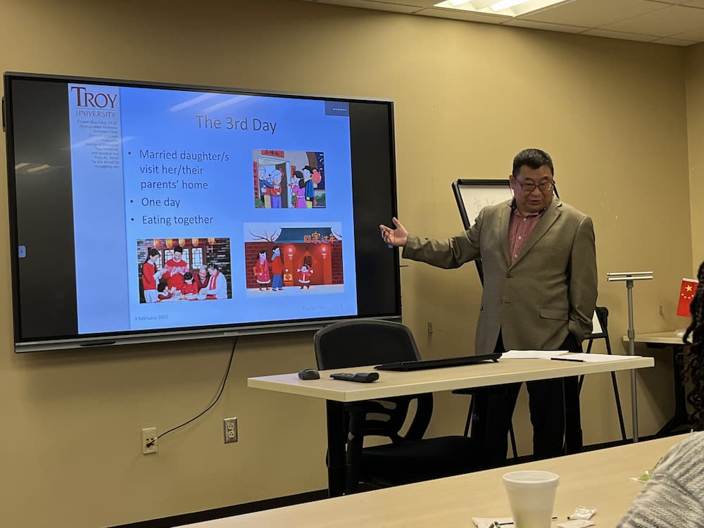 Dr. Feng talking about the traditional activities performed during the third day of the Lunar New Year festivities