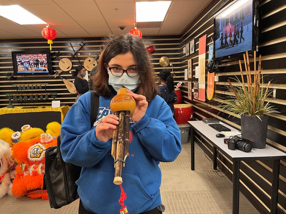 Charles Henderson Middle School student playing a traditional Chinese instrument