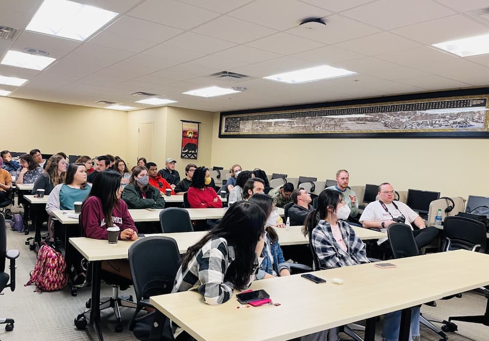 Photo of all of the attendees listening to Tibetan history, culture, and Tibetan Buddhism