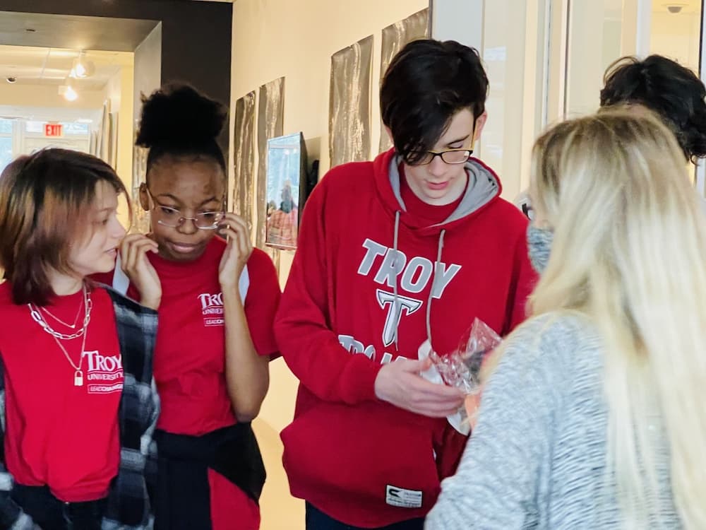 Students learning about different art styles at the International Arts Center