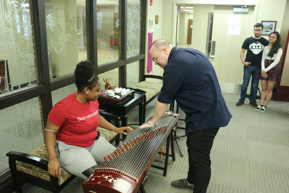 A Troy student playing the Guzheng