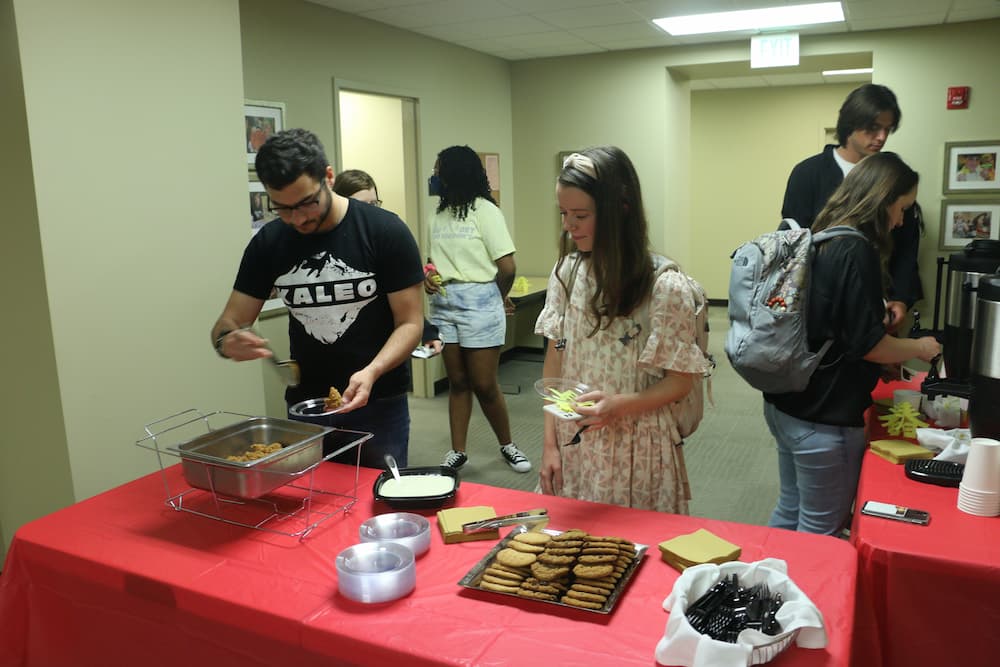 Dr. Valentine's students enjoying some tea and refreshments after a long class period