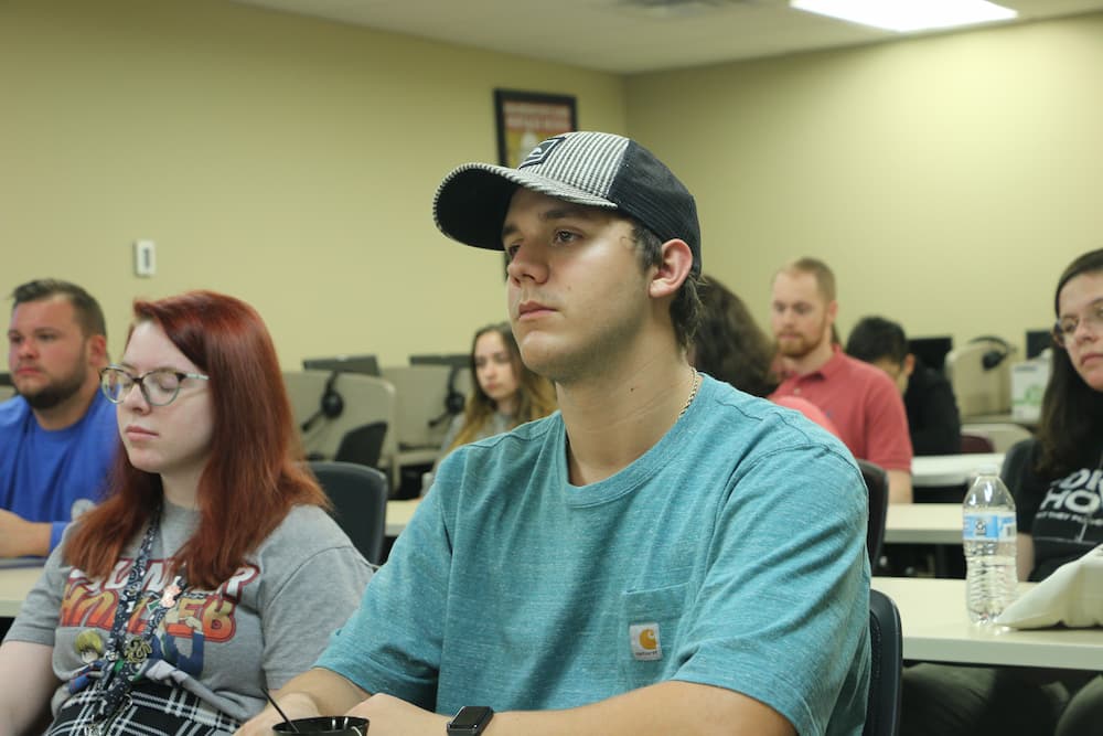 Students listening to Dr. Xu's presentation
