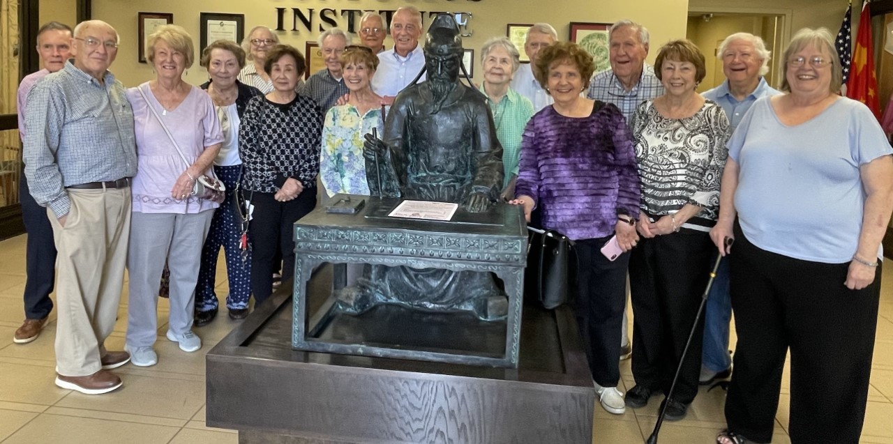 Group photo of the Sunday School class with the Confucius statue