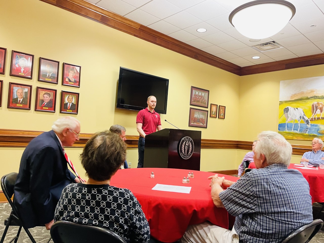 Austin Deal talking at the luncheon with Chancellor Hawkins