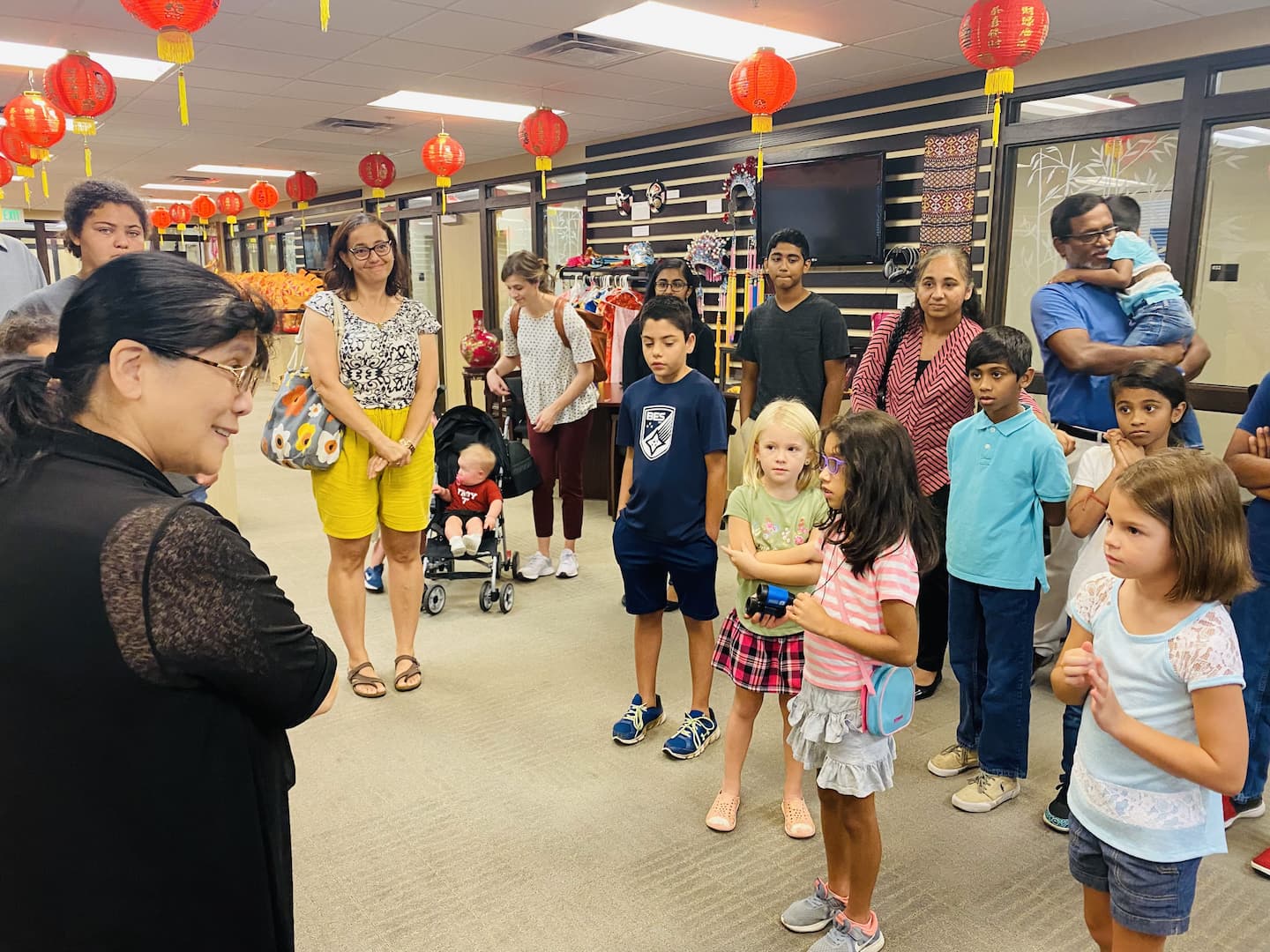 Dr. Xu welcomes students to the exhibition room