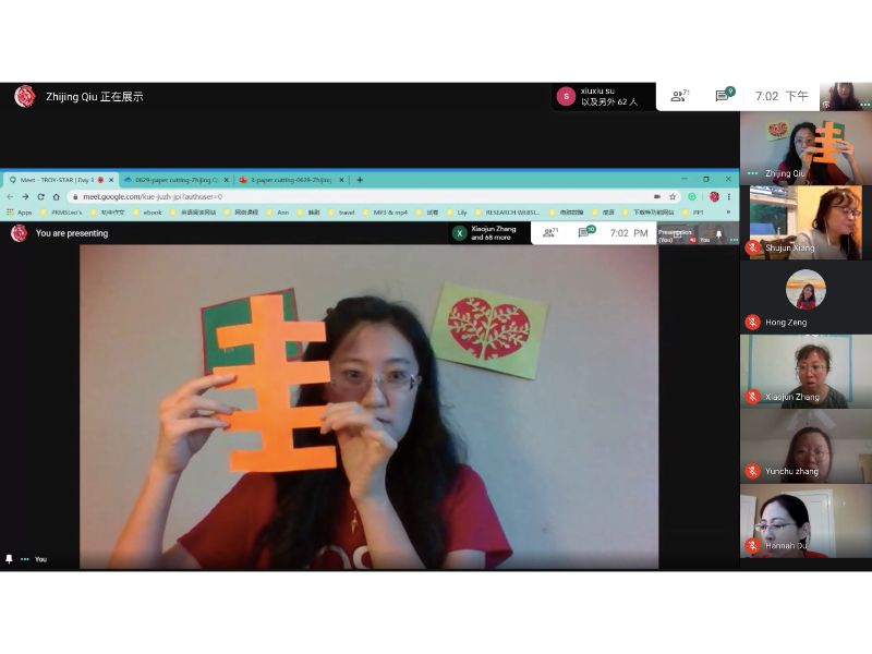 Zhijing Qiu explains the meanings of different symbols to the class.
