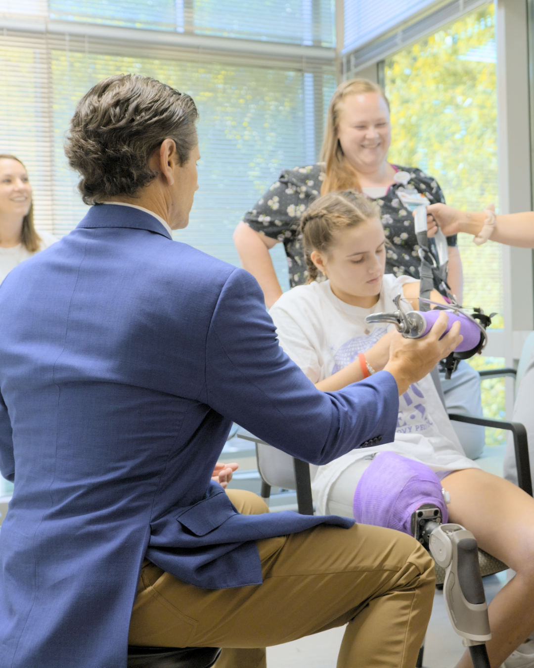 Lulu with her Surgeons and Nurses trying on prosthetics