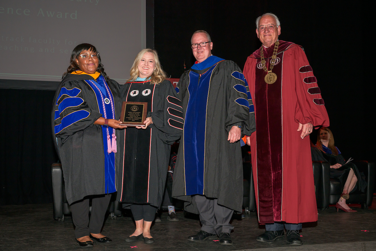Dr. Robert Kruckeberg Faculty Senate Excellence Award being awarded to the recipient