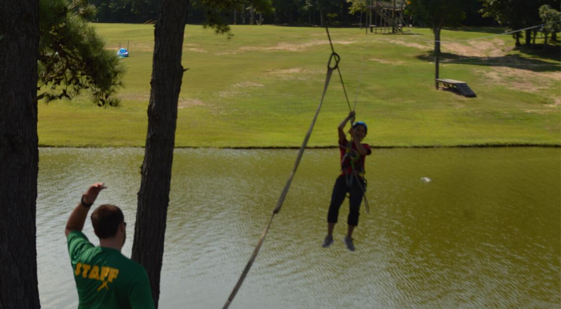 New student on the zipline at Camp Butter and Egg during Orientation. 