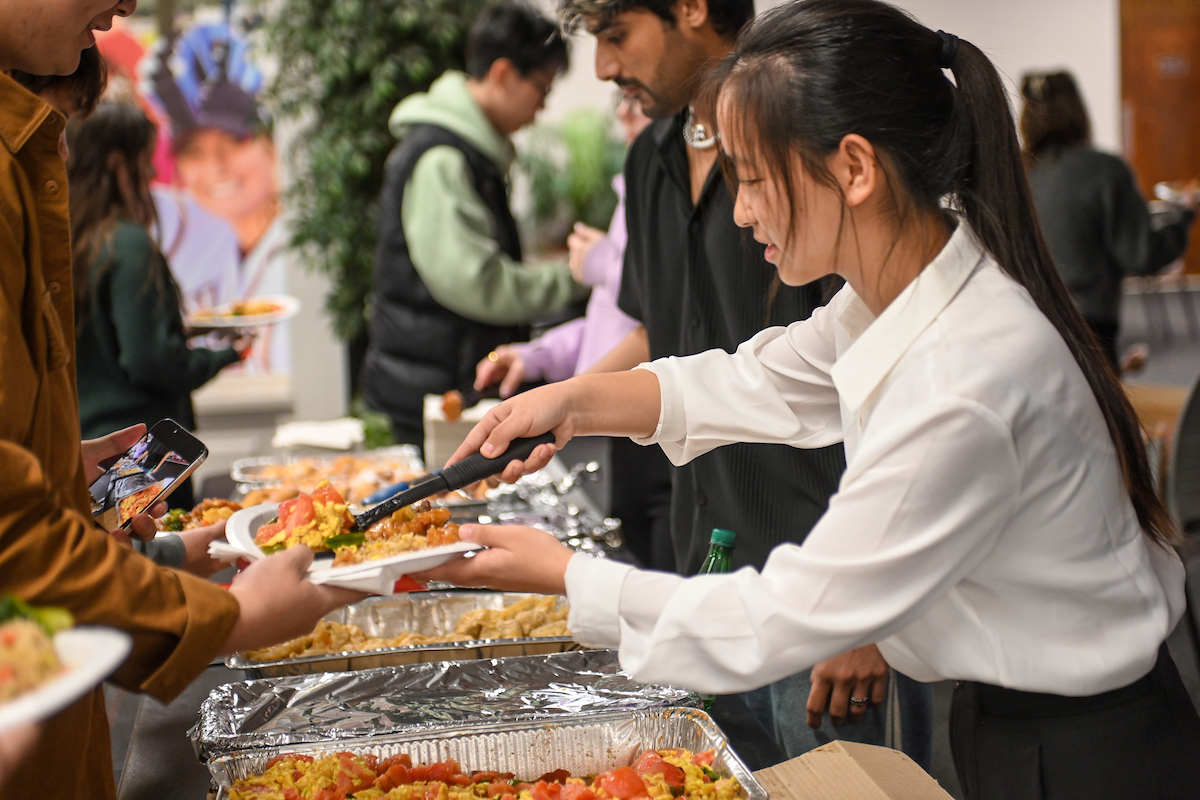 Students serving food during their festival