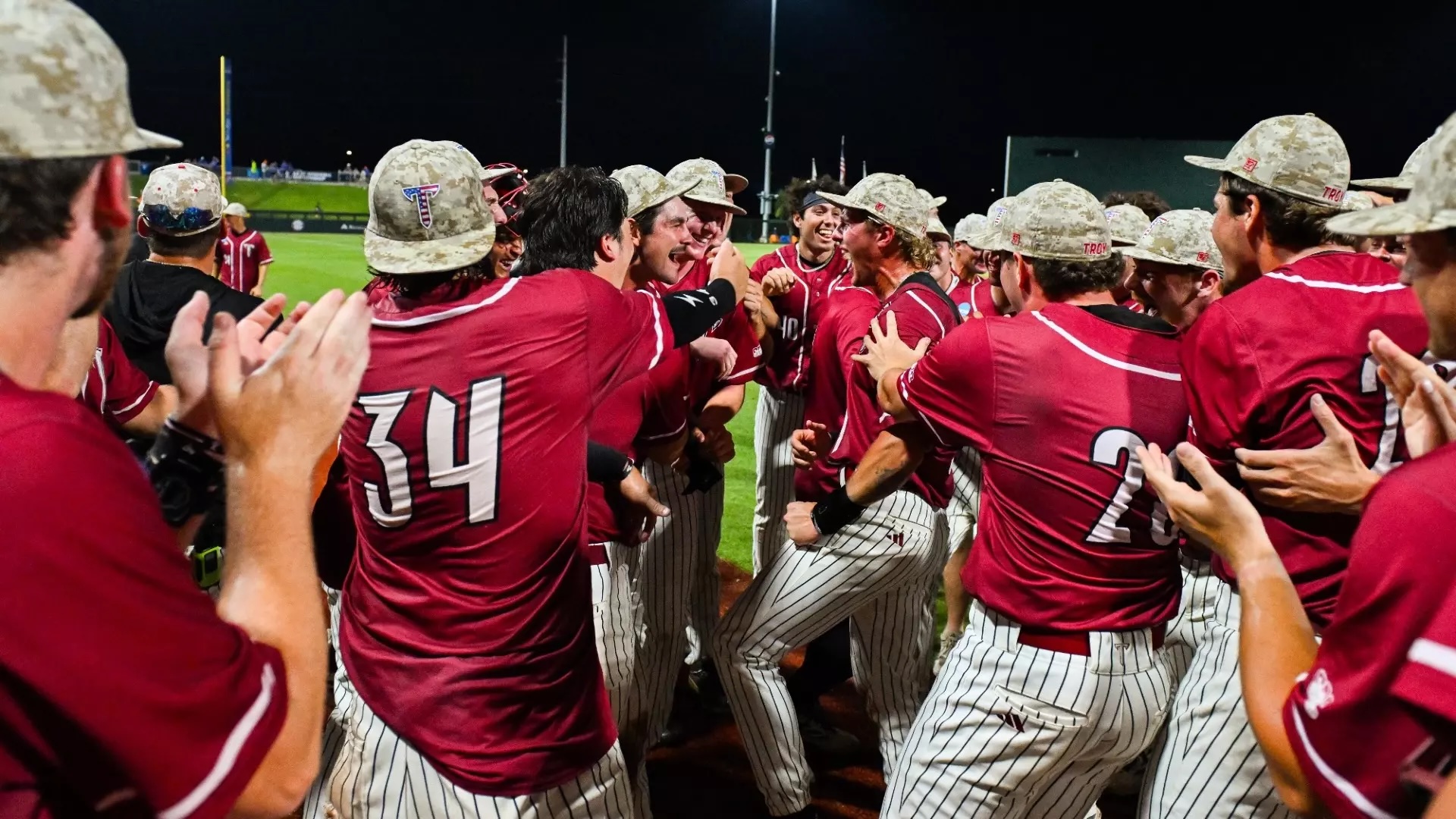TROY Baseball celebrating their win in Gainesville.