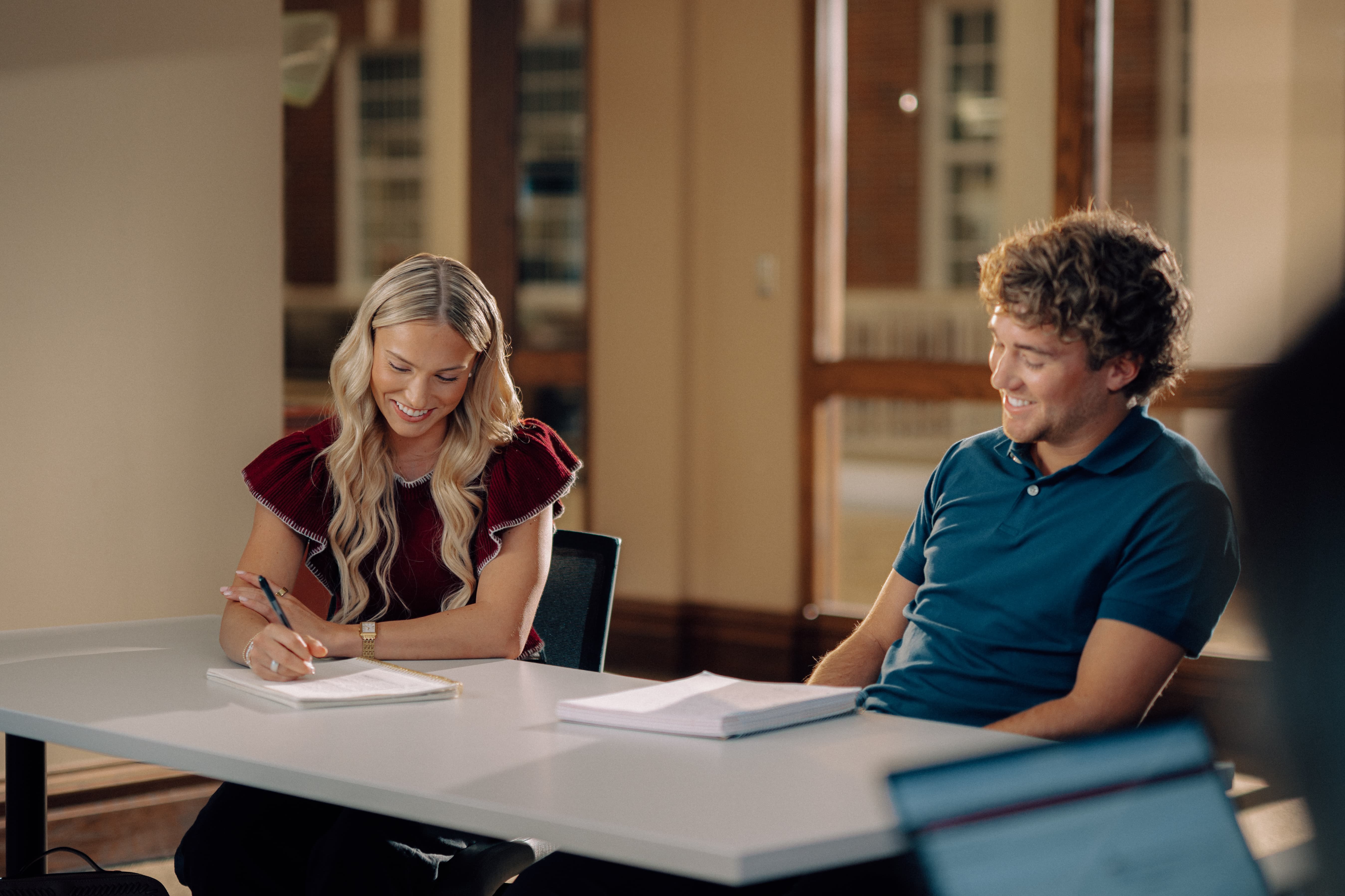Two TROY business students study in John Robert Lewis Hall