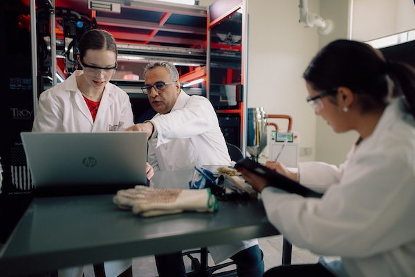 students learning from their professor in the CMMS lab