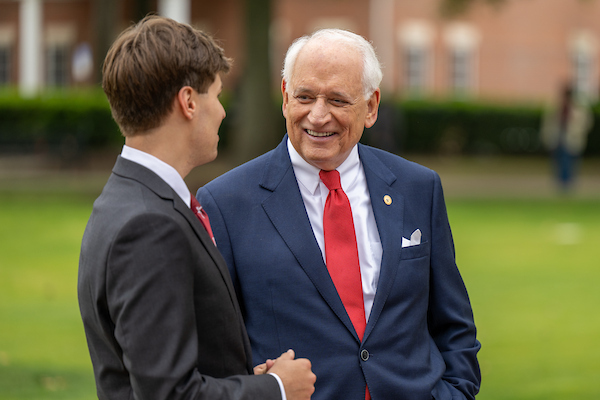 Dr. Jack Hawkins speaking with the SGA President.