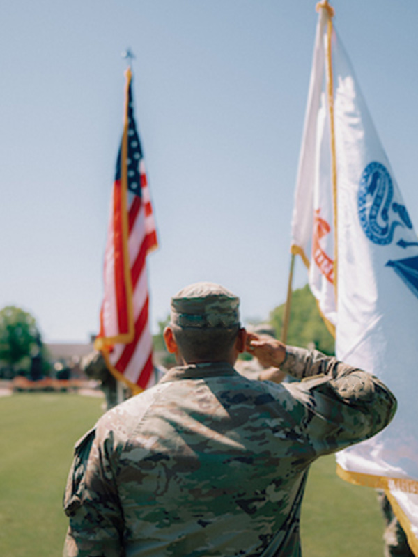 American Flag held by ROTC cadets training on TROY campus
