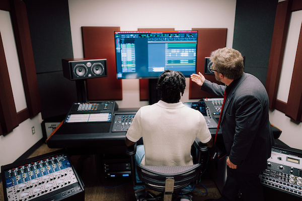 Student and professor in the recording studio