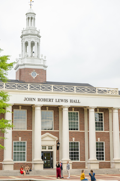 The front of John Robert Lewis with Dr. Hawkins and other students around