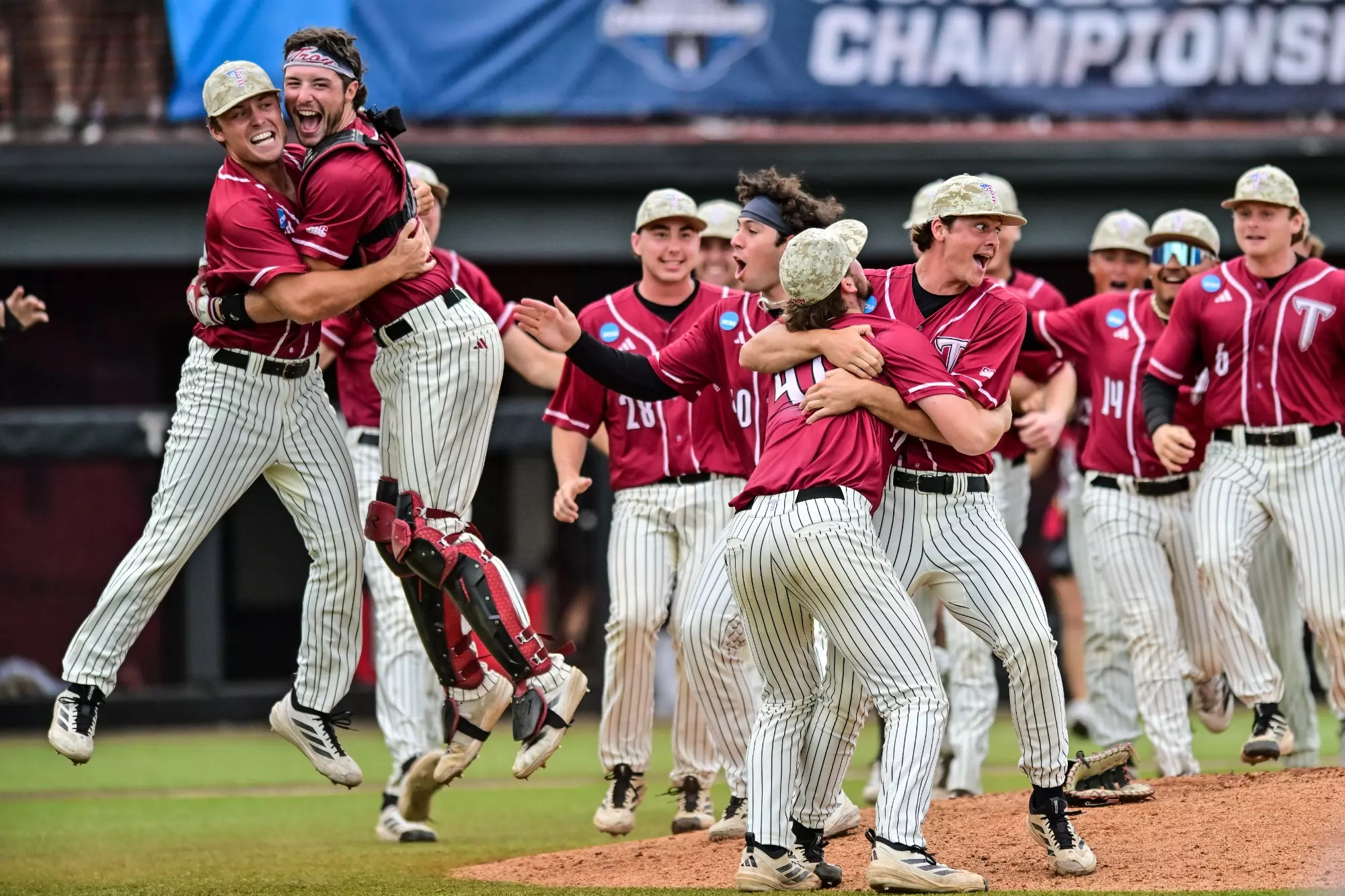 TROY Baseball players celebrating their Super Regional win.