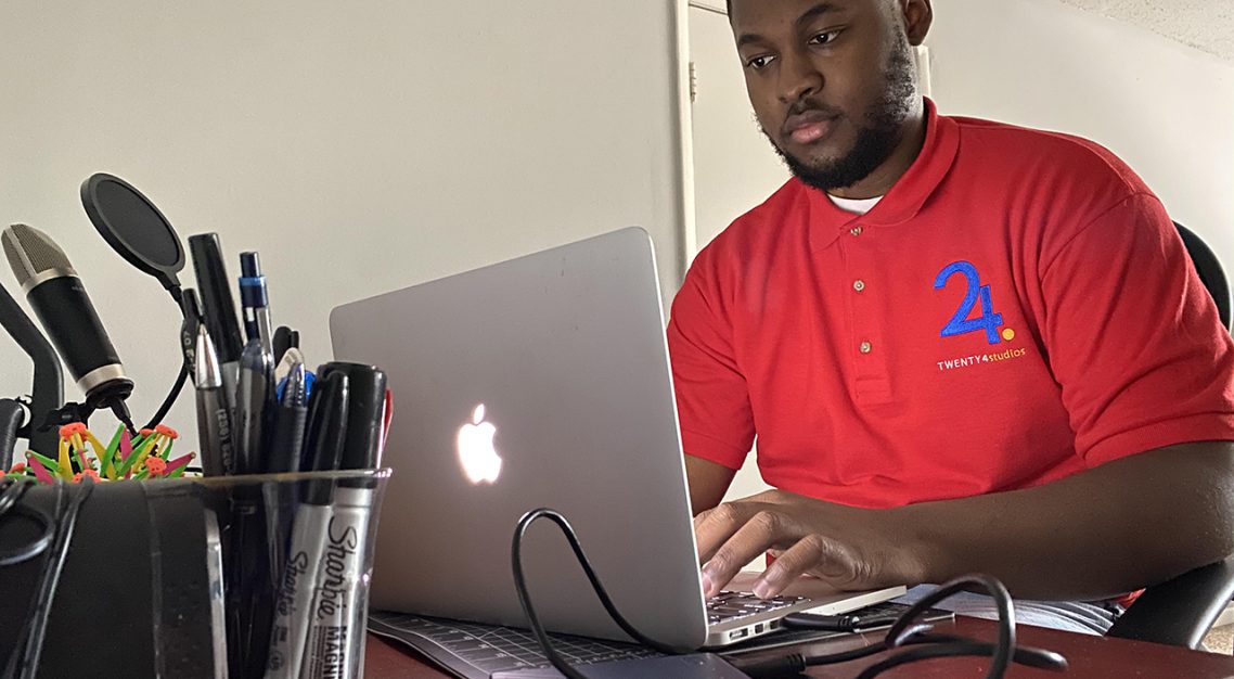 TROY Alumni Kenneth Jenkins on computer