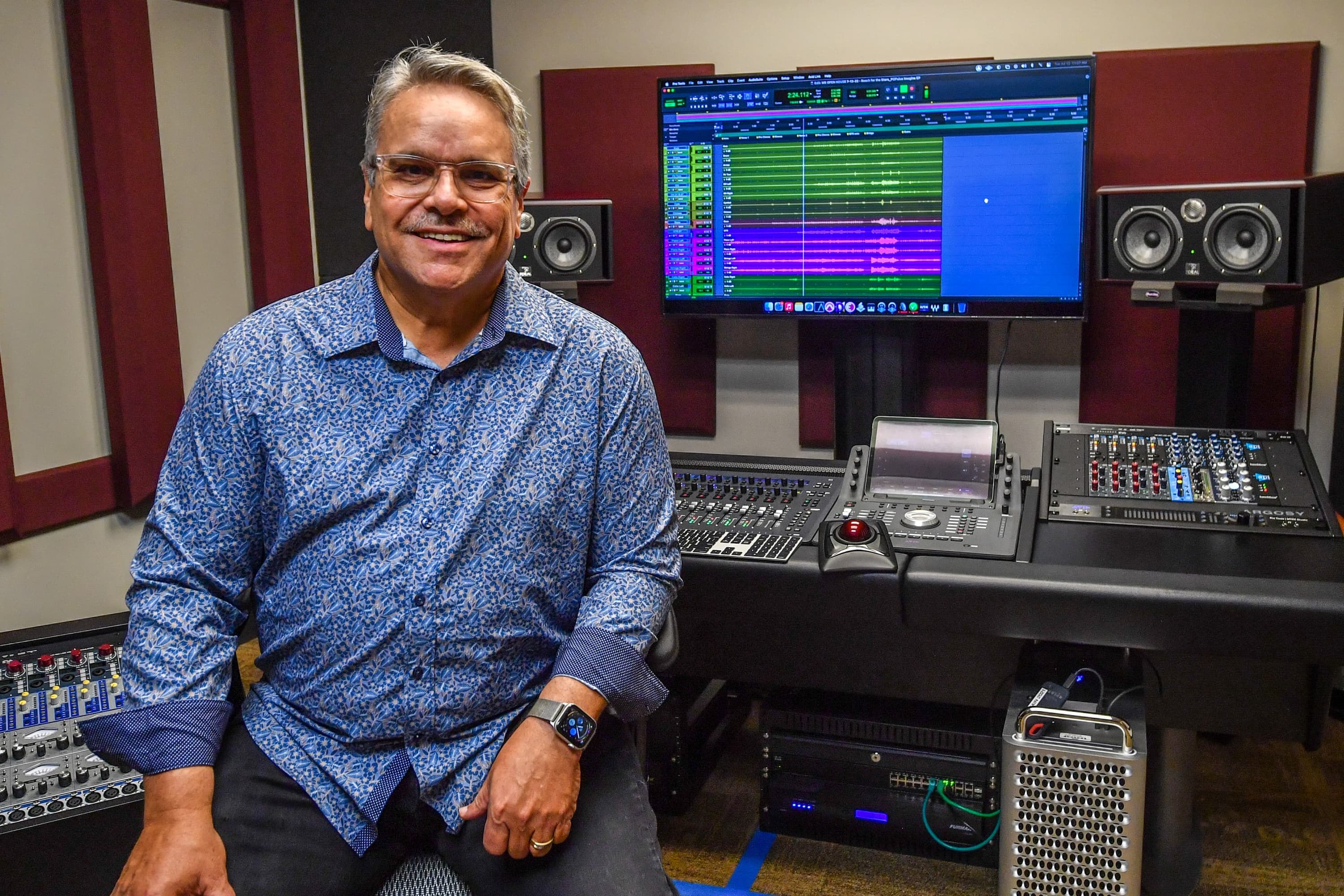 Music Industry Program Coordinator, Robert W. Smith, is seen in the recording studio located in the John M. Long School of Music.