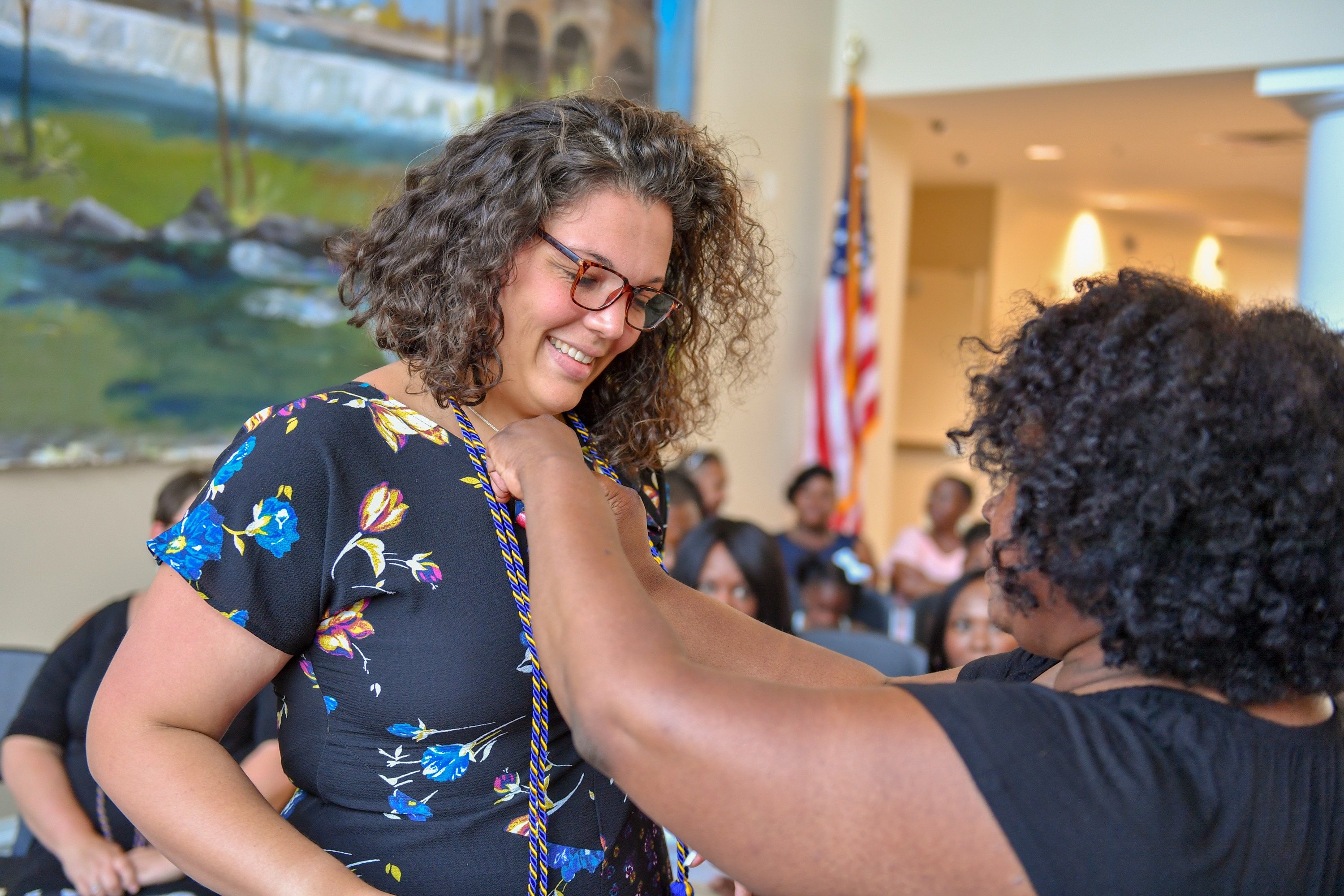Student getting pinned at social work pinning ceromony 