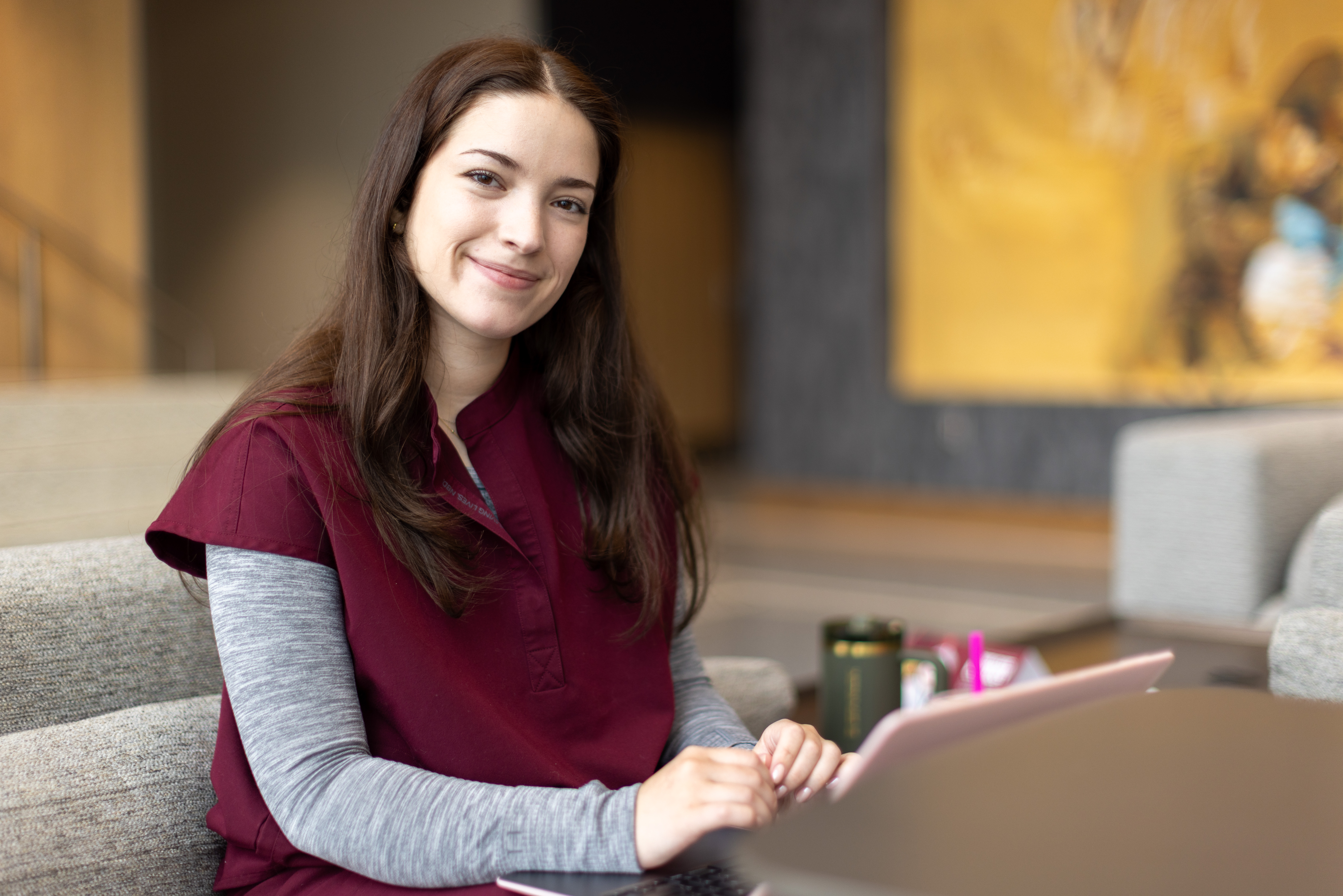 Social work student studying in Jones Hall lobby