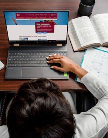 Image of Person Using a Computer