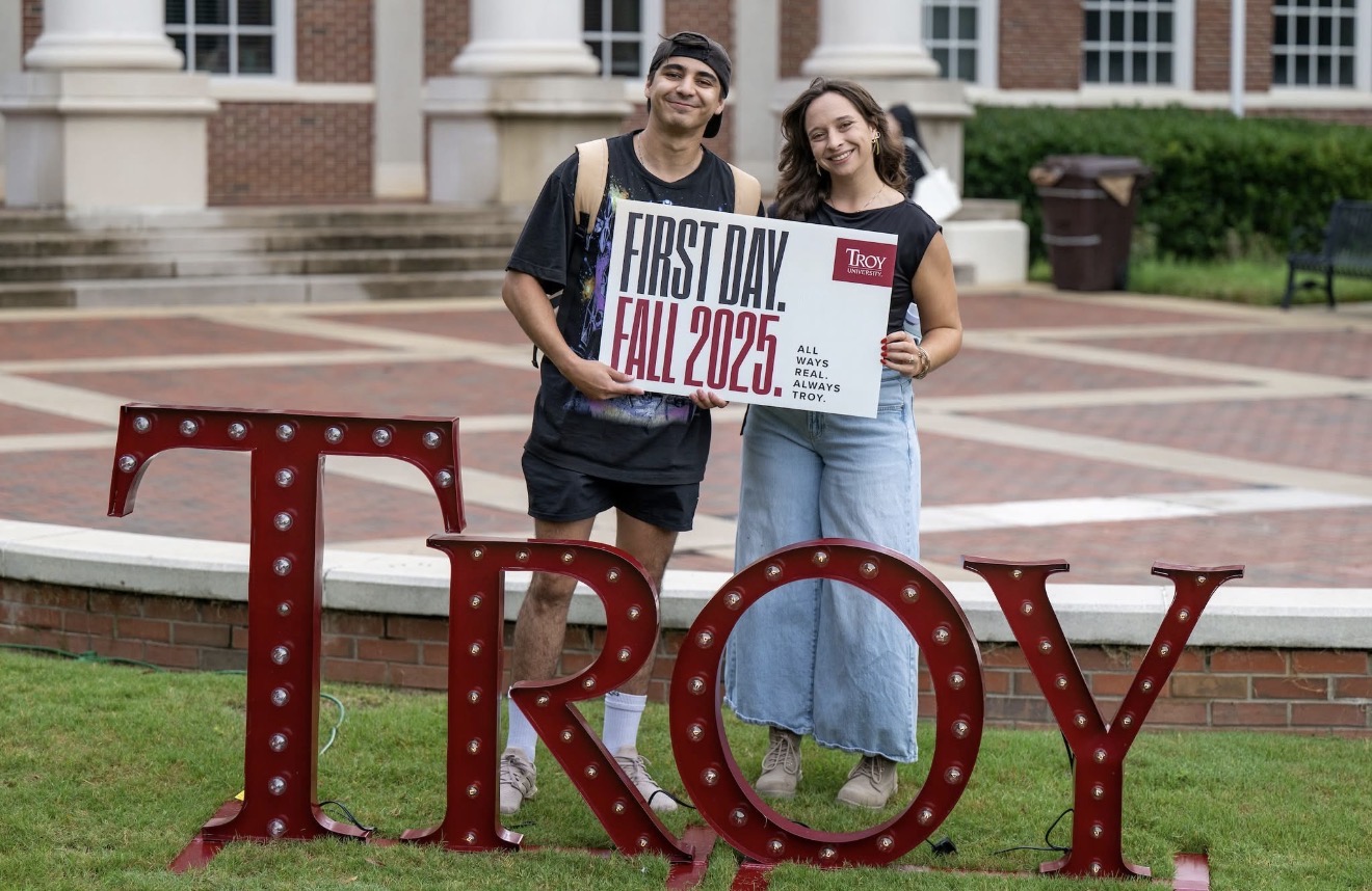 Students holding a sign that says first day of class 2025.