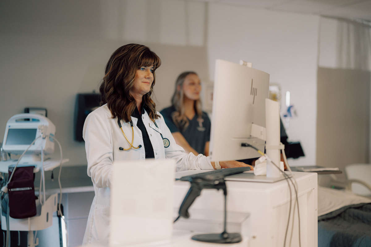 Doctor working at her computer in the doctors office