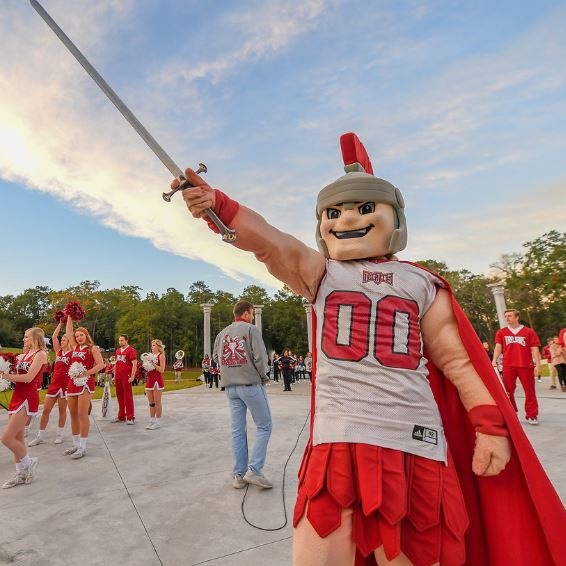 T-roy holding a sword up at the Amphitheater