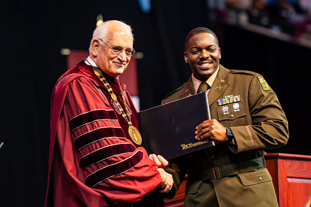 Student in uniform at commencement