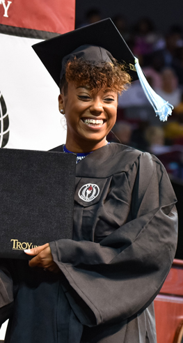 Student receives diploma at commencement